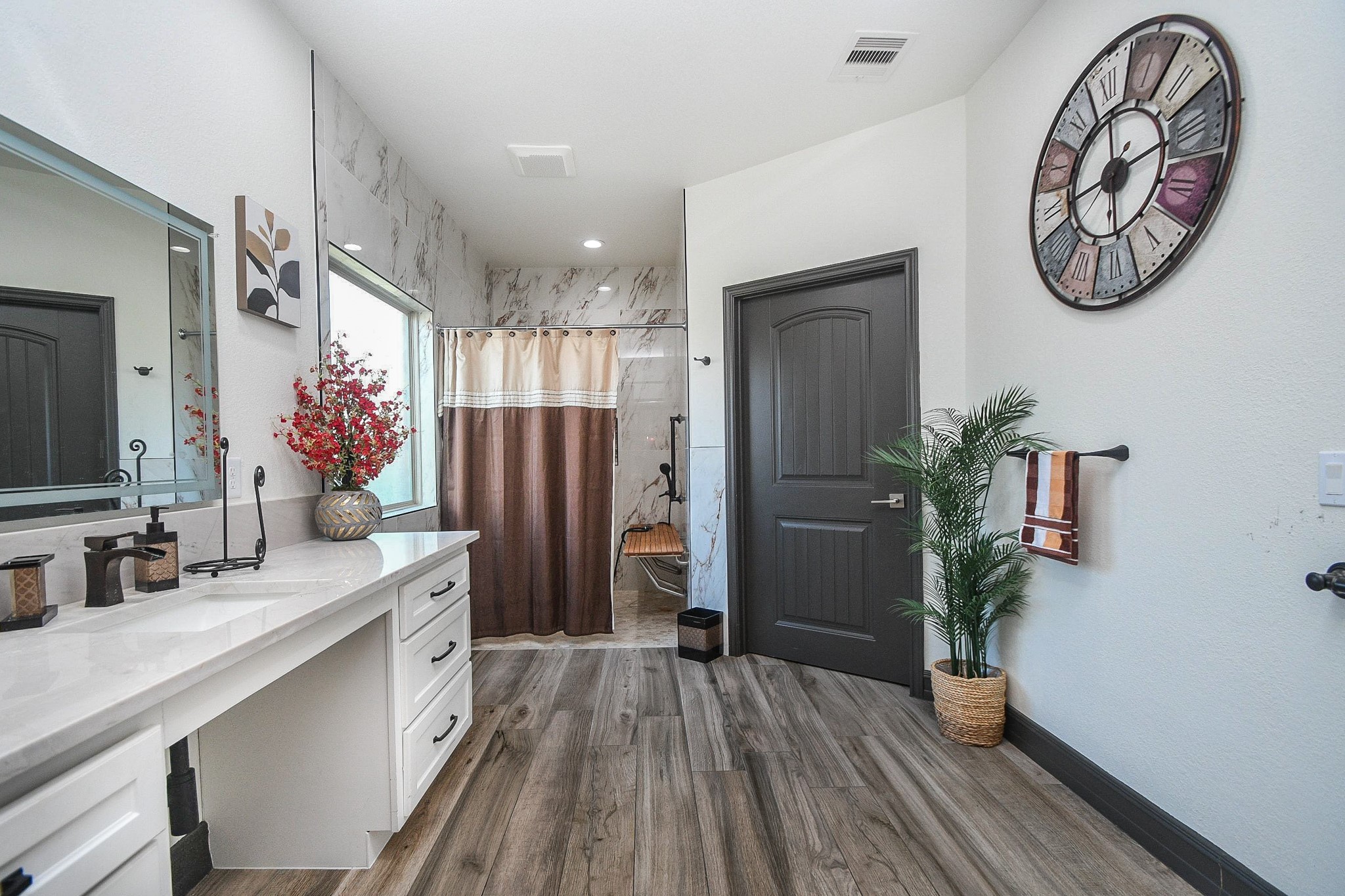 4331 Estes Ridge Lane Katy, TX 77493 - Photo 21 of 42 a bathroom with a sink a mirror and a shower