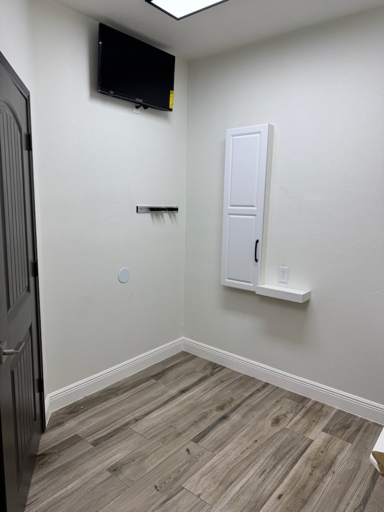 4331 Estes Ridge Lane Katy, TX 77493 - Photo 23 of 42 a view of room with wooden floor and flat screen tv