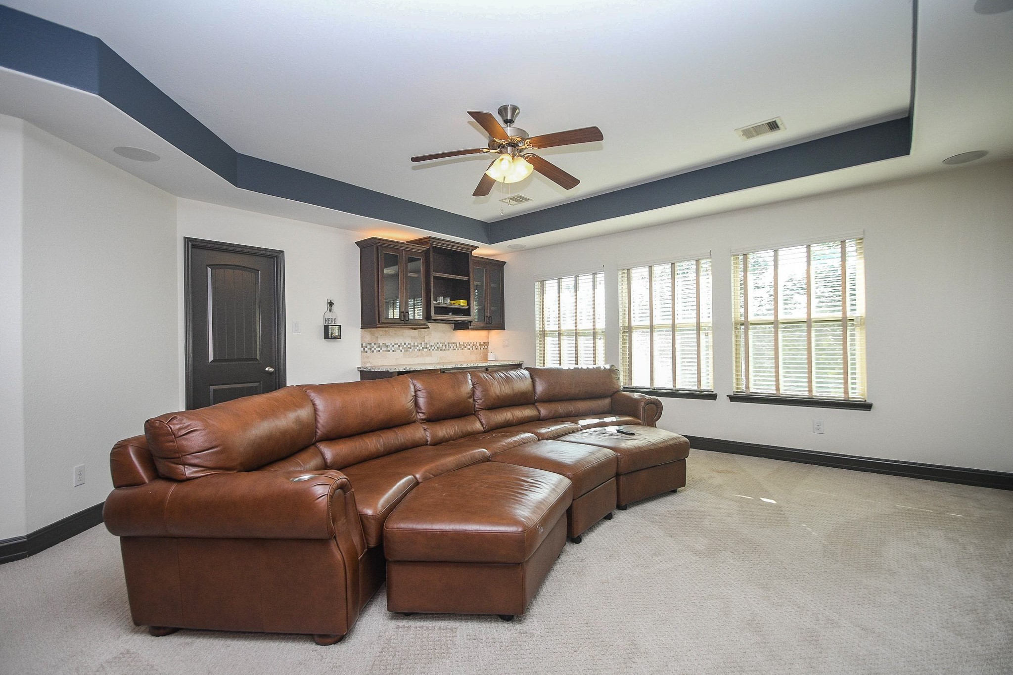 4331 Estes Ridge Lane Katy, TX 77493 - Photo 29 of 42 a living room with furniture ceiling fan and a window