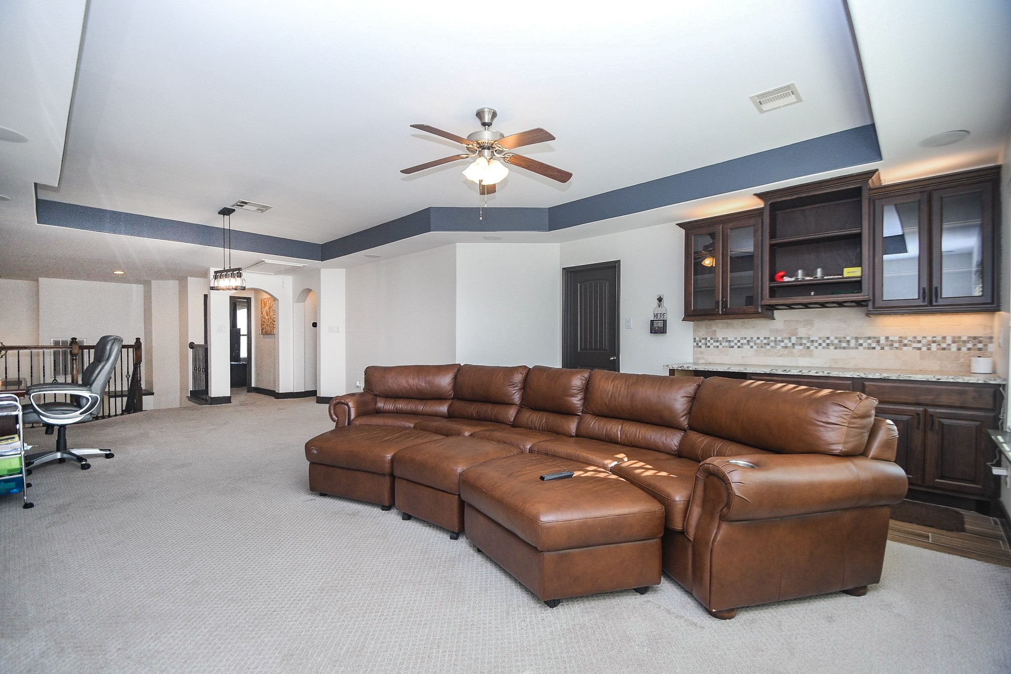 4331 Estes Ridge Lane Katy, TX 77493 - Photo 30 of 42 a living room with furniture and a ceiling fan