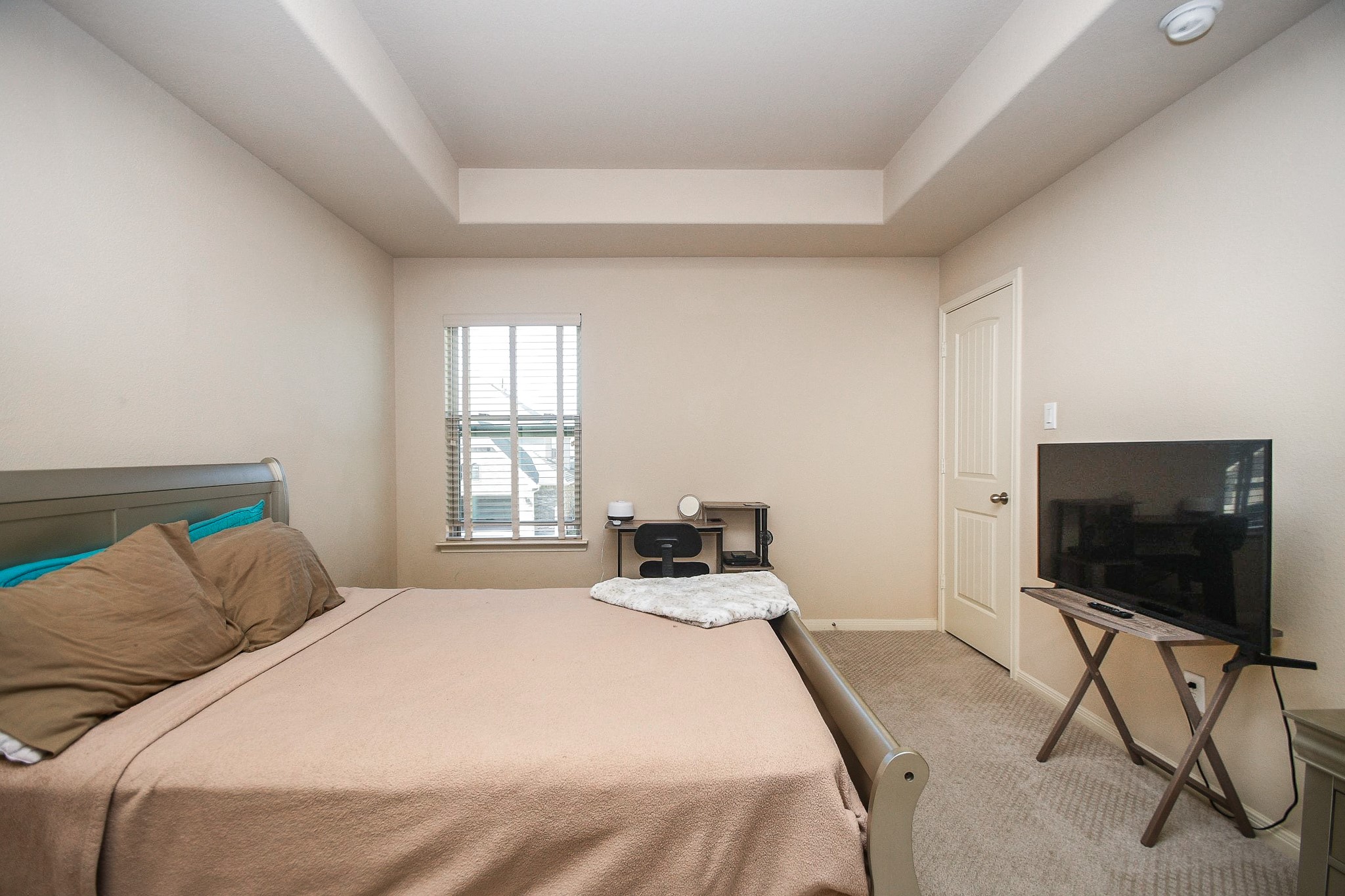 4331 Estes Ridge Lane Katy, TX 77493 - Photo 37 of 42 a bedroom with a bed and a flat screen tv