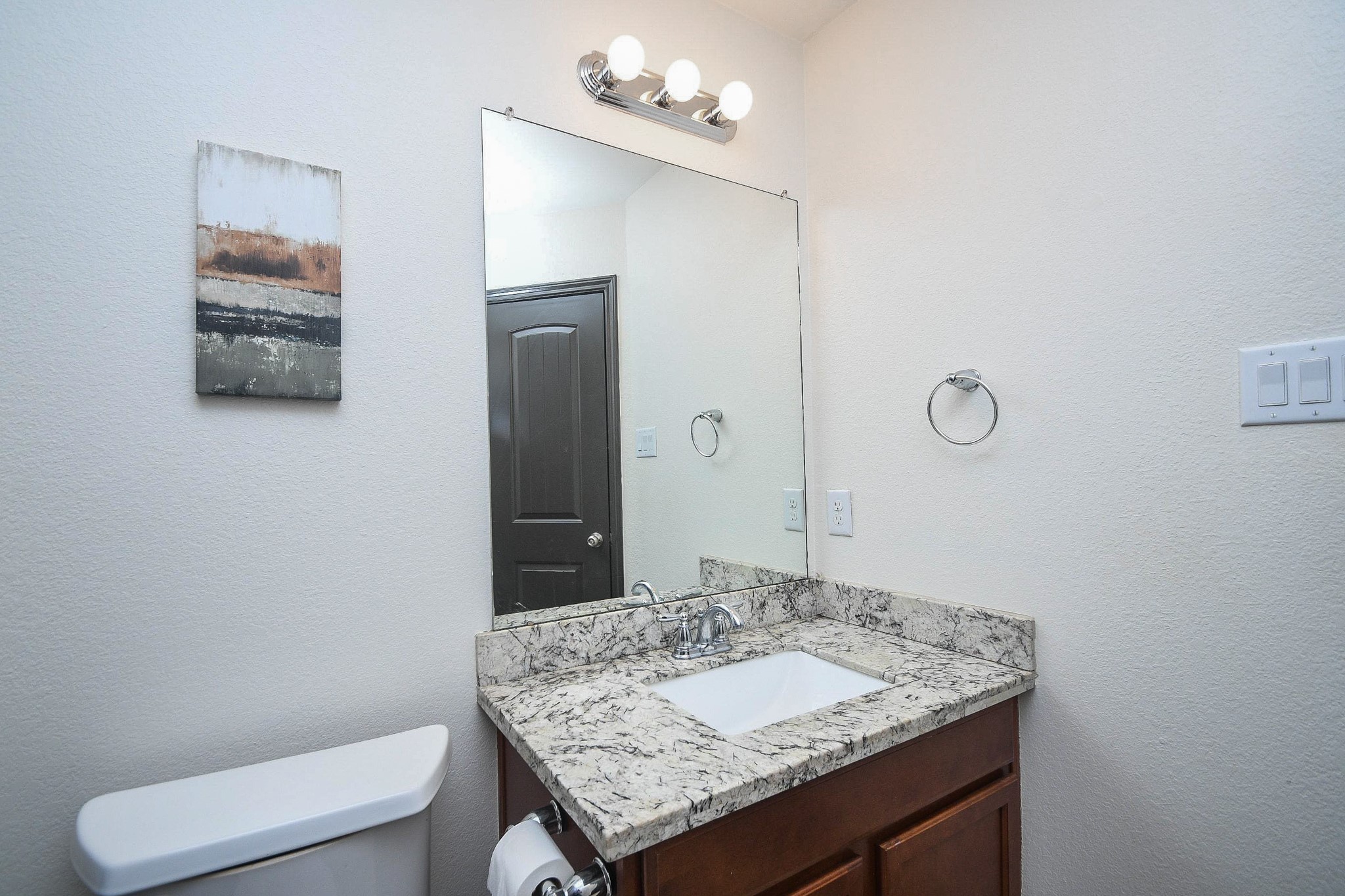 4331 Estes Ridge Lane Katy, TX 77493 - Photo 38 of 42 a bathroom with a granite countertop sink and a mirror