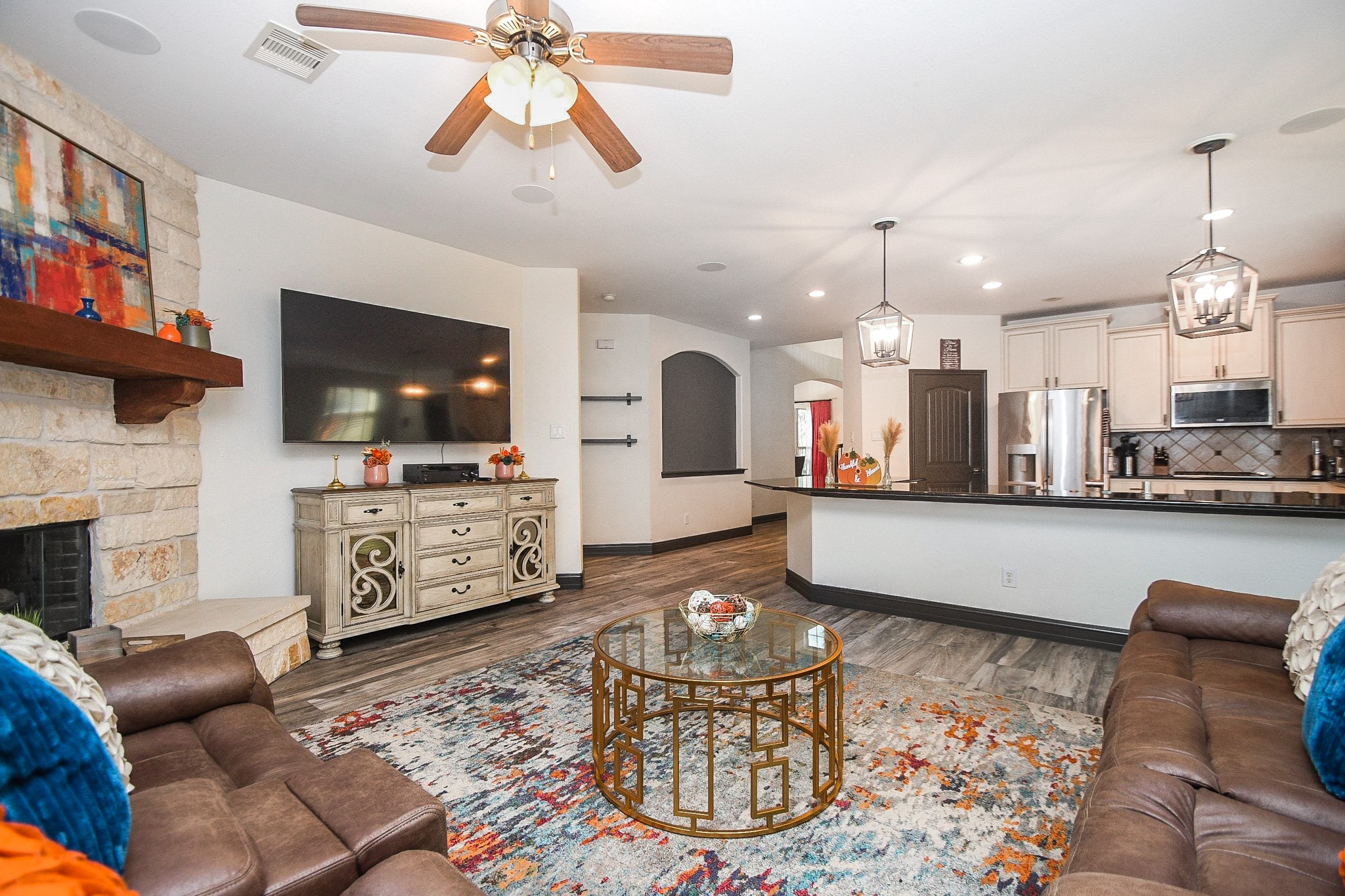 4331 Estes Ridge Lane Katy, TX 77493 - Photo 10 of 42 a living room with fireplace furniture and a flat screen tv