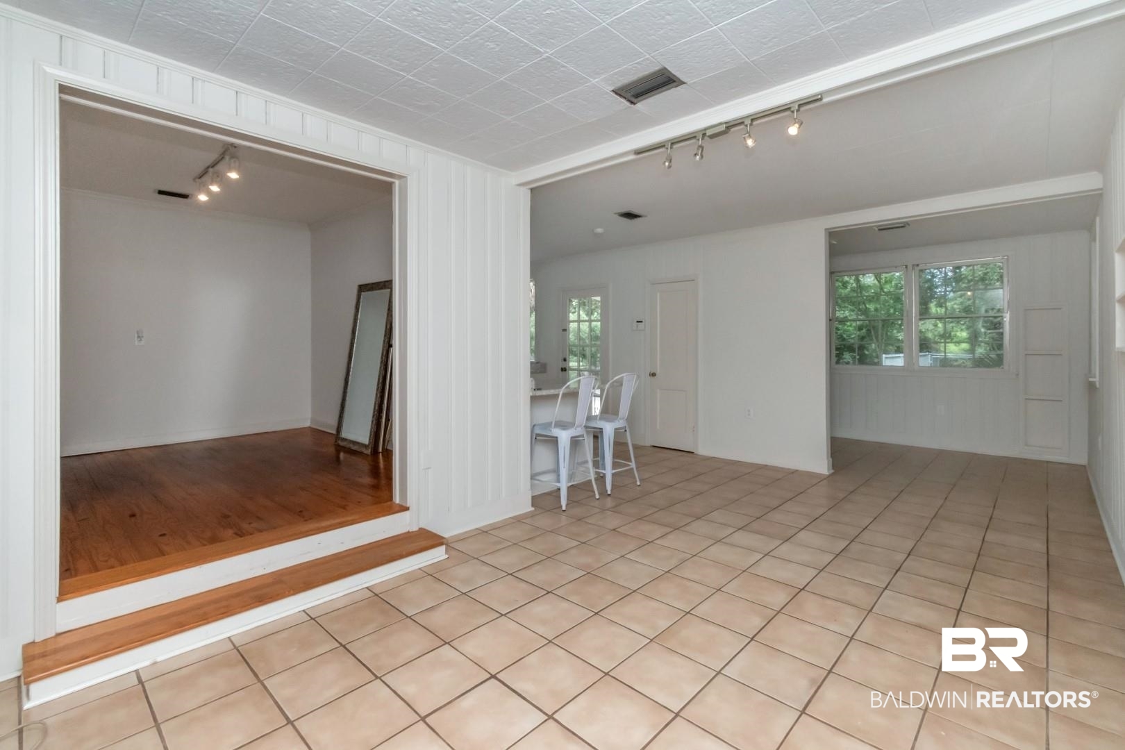 1906 Old Shell Road Mobile, AL 36607 - Photo 16 of 26 Tiled spare room featuring track lighting and plenty of natural light