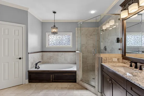 a bathroom with a granite countertop sink mirror and double