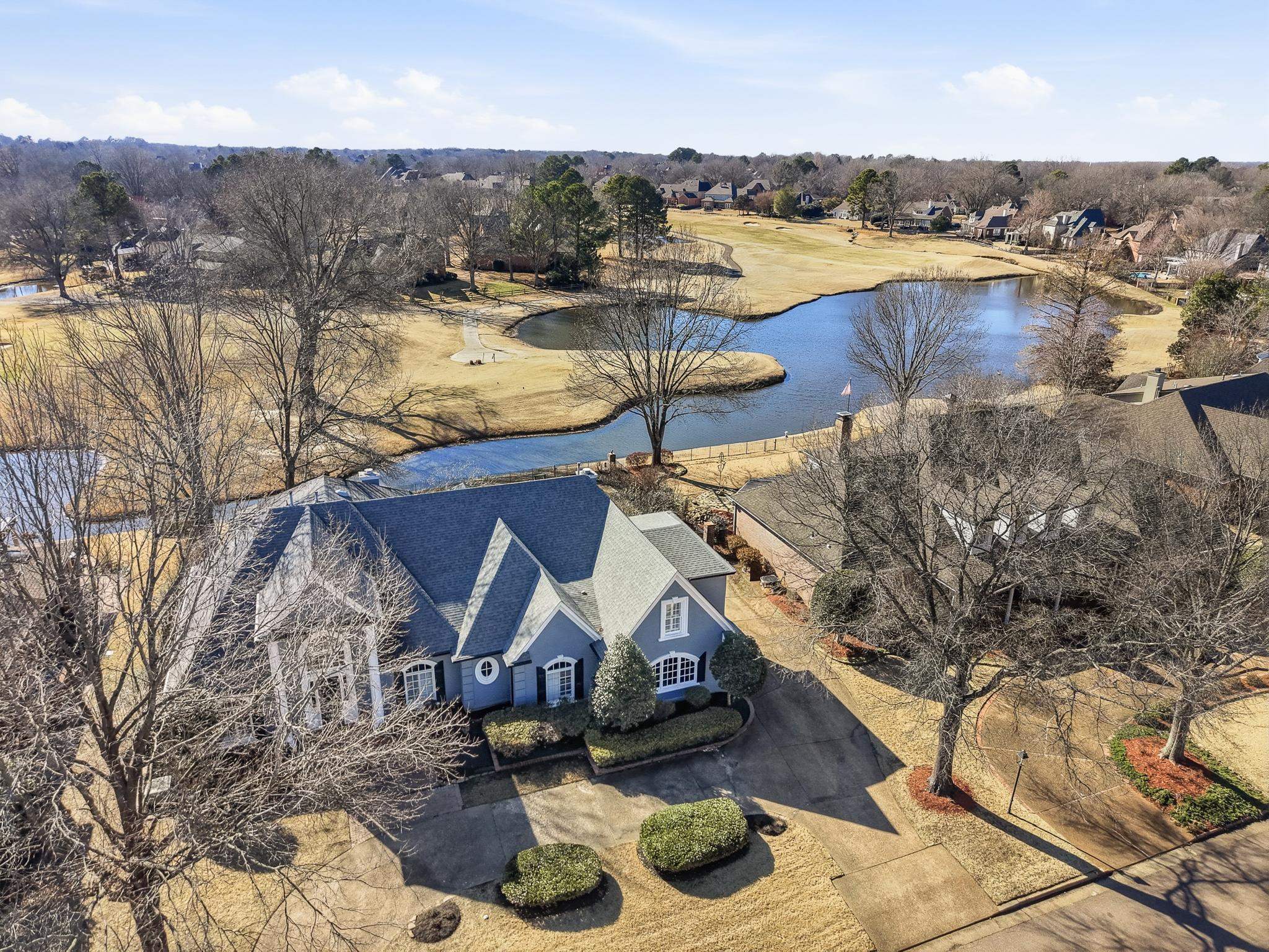 2283 Shrewsbury Run East Collierville, TN 38017 - Photo 21 of 40 a view of a lake with couches and wooden floor