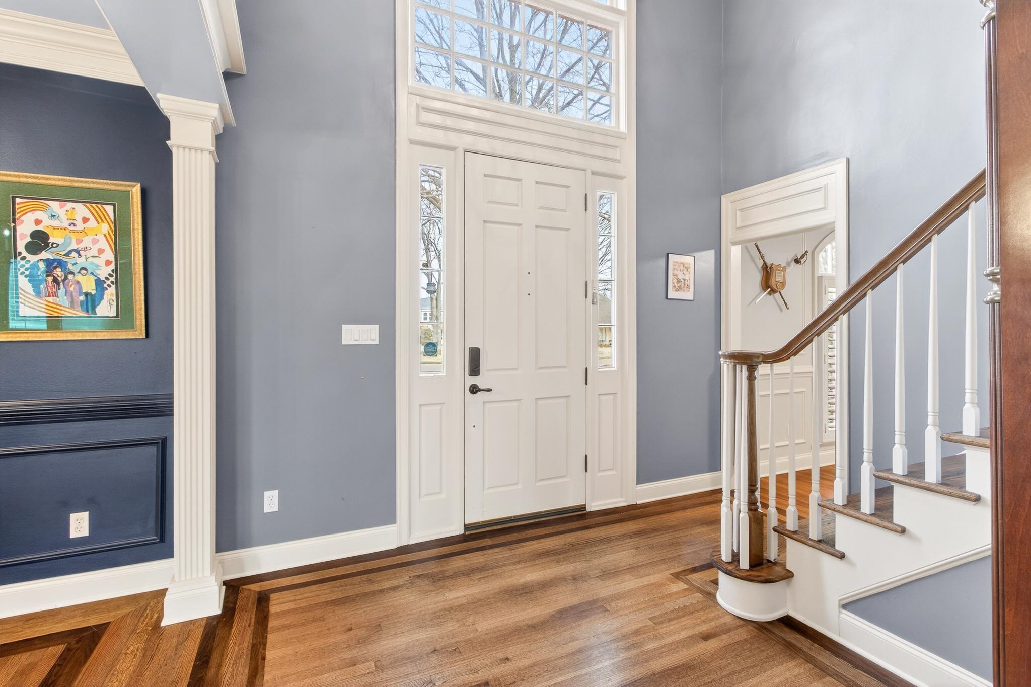 2283 Shrewsbury Run East Collierville, TN 38017 - Photo 27 of 40 a view of front door with hallway and wooden floor