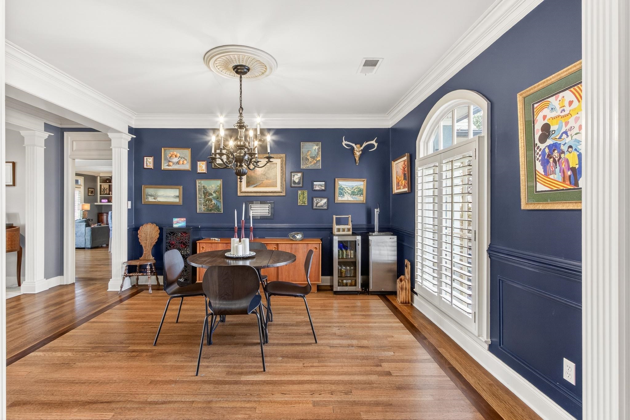 2283 Shrewsbury Run East Collierville, TN 38017 - Photo 37 of 40 a dining room with chandelier and wooden floor