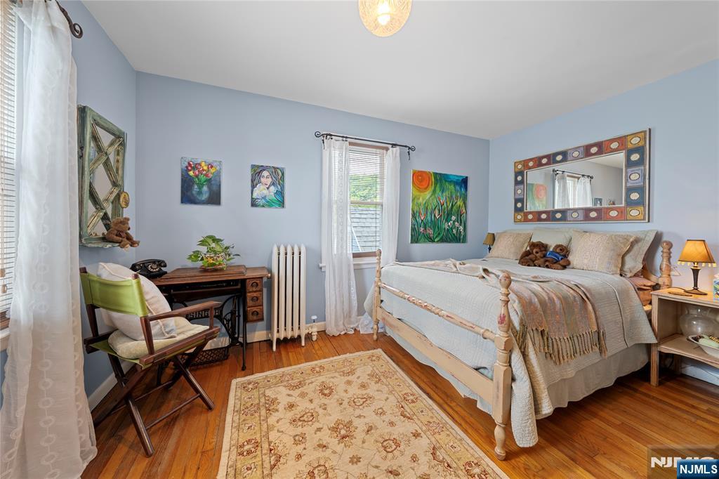 5 Leo Terrace Bloomfield, NJ 07003 - Photo 13 of 32 a bed room with a bed and a chair