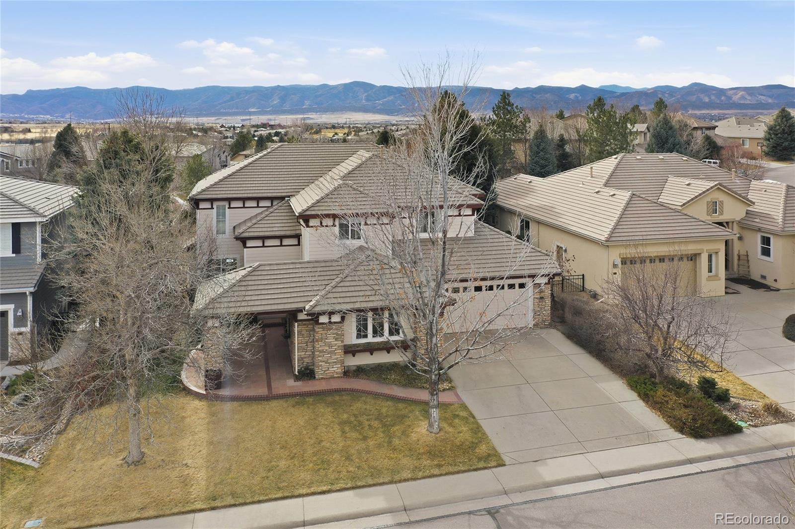 8967 Hunters Way Highlands Ranch, CO 80129 - Photo 14 of 50 an aerial view of a house with a yard