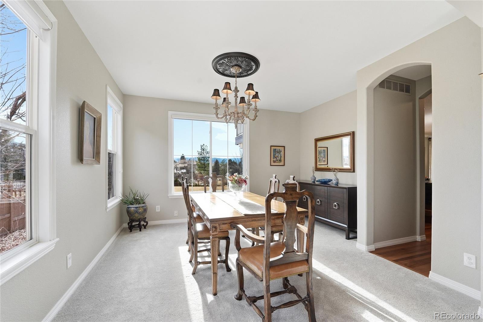 8967 Hunters Way Highlands Ranch, CO 80129 - Photo 19 of 50 a view of a dining room with furniture and window