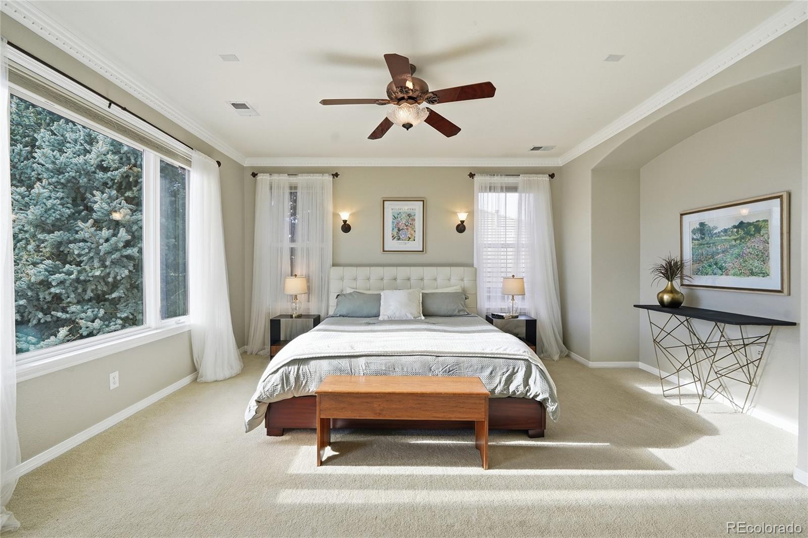 8967 Hunters Way Highlands Ranch, CO 80129 - Photo 27 of 50 a bedroom with a bed and window