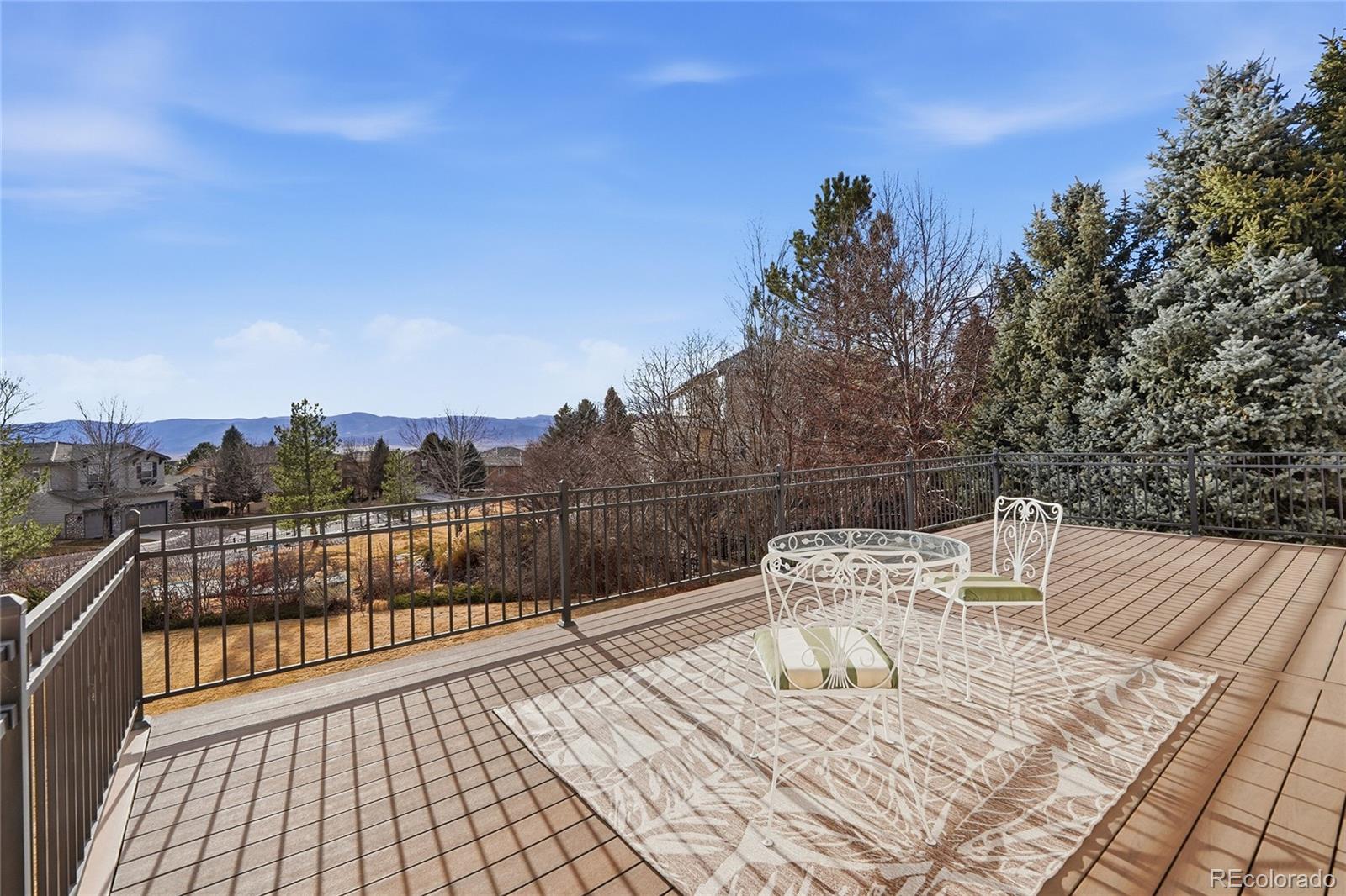 8967 Hunters Way Highlands Ranch, CO 80129 - Photo 8 of 50 a view of a terrace with seating space