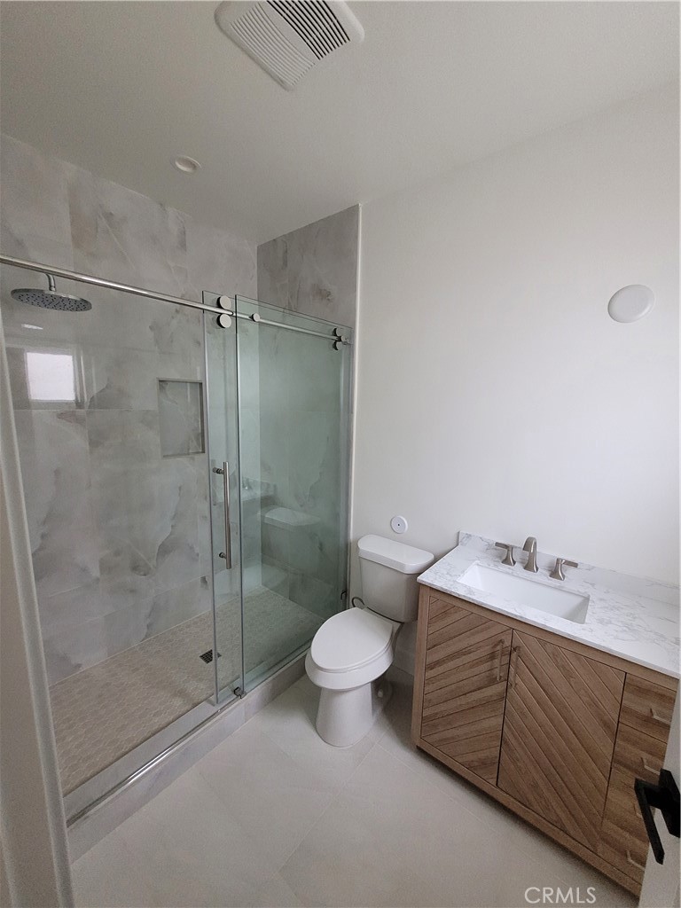 19455 Strathern Street Reseda, CA 91335 - Photo 11 of 11 a bathroom with a sink toilet and shower