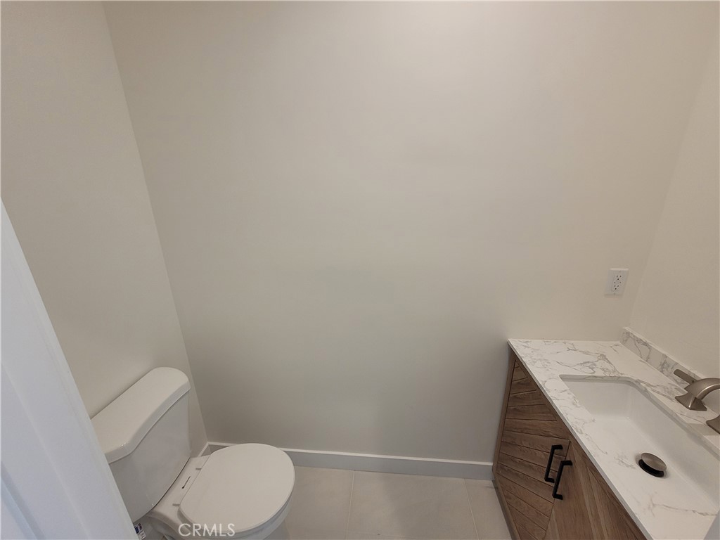 19455 Strathern Street Reseda, CA 91335 - Photo 5 of 11 a bathroom with a sink and a toilet