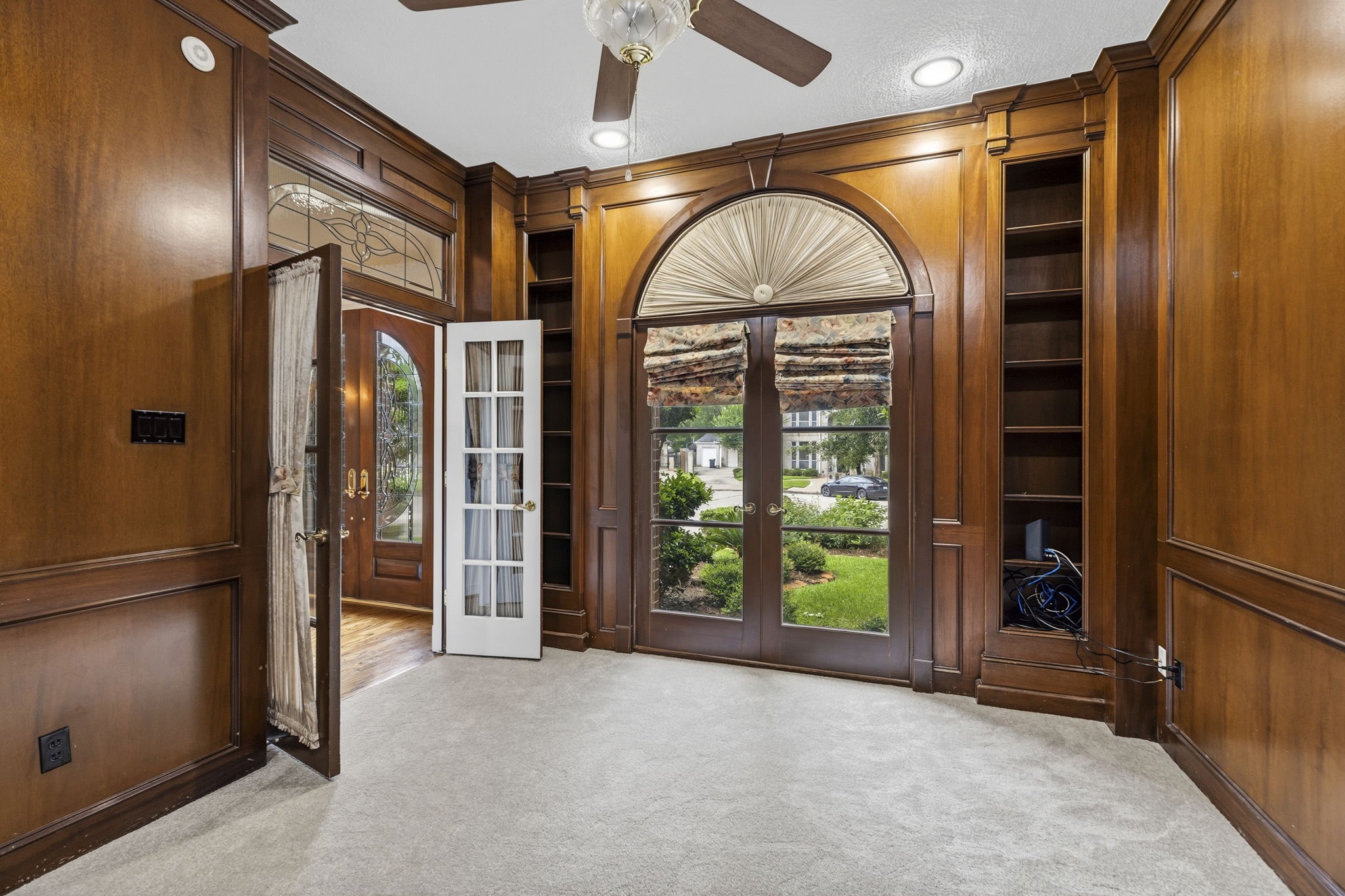 18310 Pamela Way Spring, TX 77379 - Photo 9 of 42 Dark paneling enhances the richness of the study.