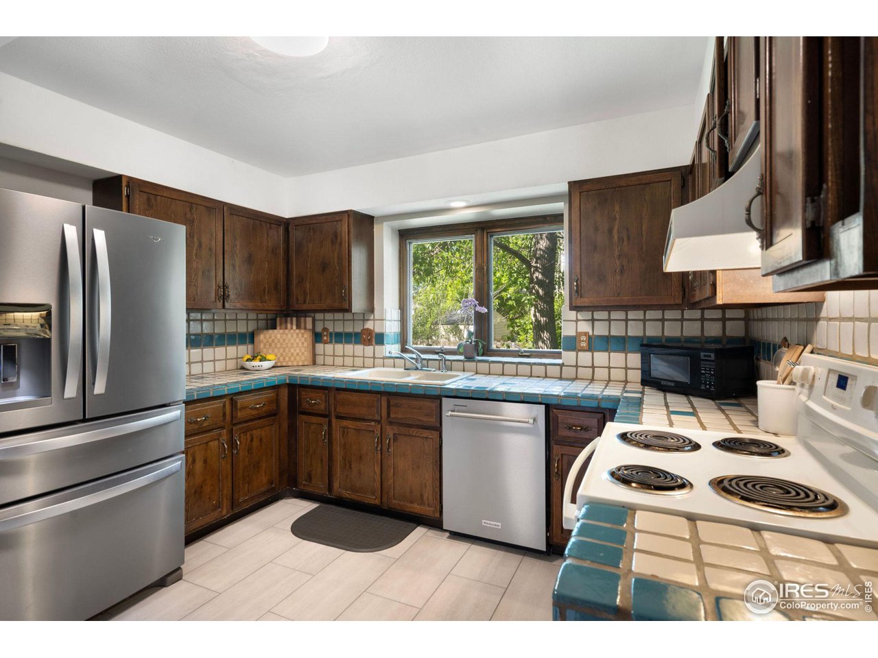 921 East Ridgecrest Road Fort Collins, CO 80524 - Photo 11 of 32 New tile floor and all kitchen appliances included
