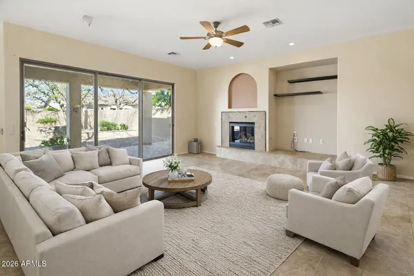 a living room with furniture and a fireplace