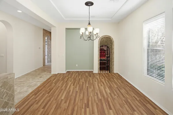 a view of an empty room with a fireplace and a window