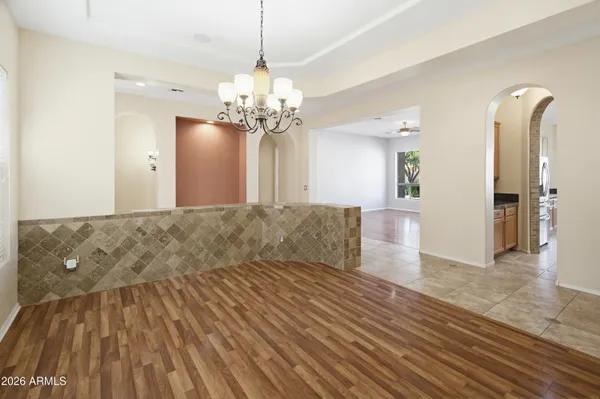 a large kitchen with stainless steel appliances granite countertop a stove a sink and a refrigerator