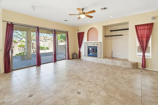 a kitchen with stainless steel appliances granite countertop a sink a counter space and windows