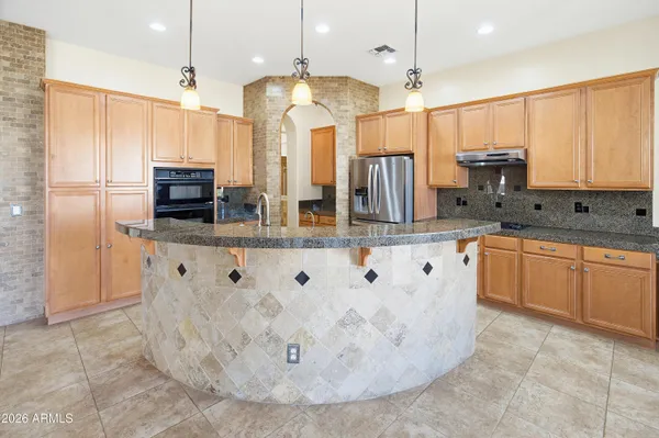 a view of a house with brick walls