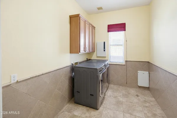 a view of a patio with a table and chairs and potted plants