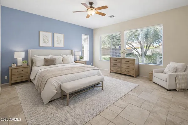 a view of a patio with furniture and a fire pit