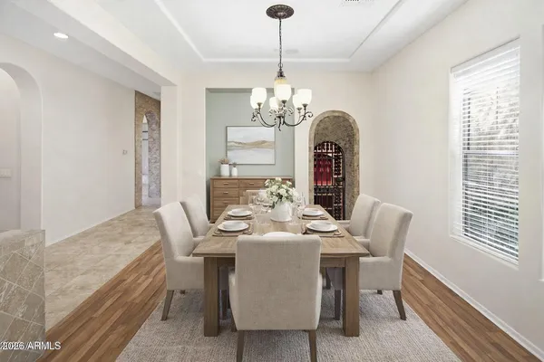 a view of a house with backyard and a tree