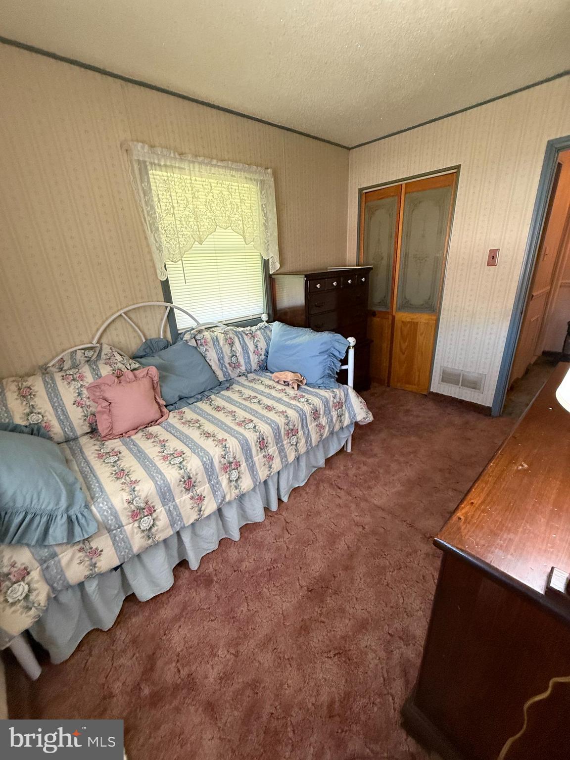 12018 Academy Road Philadelphia, PA 19154 - Photo 13 of 24 a bedroom with a bed and a window