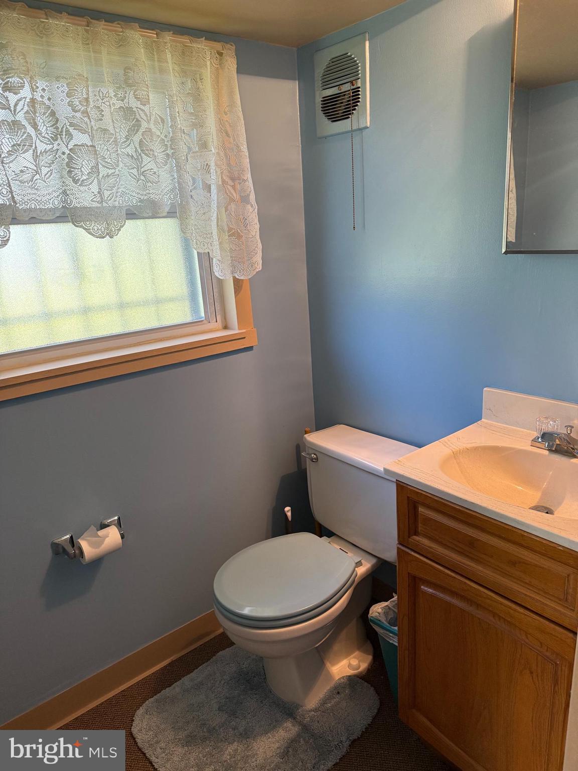 12018 Academy Road Philadelphia, PA 19154 - Photo 17 of 24 a bathroom with a toilet and a window