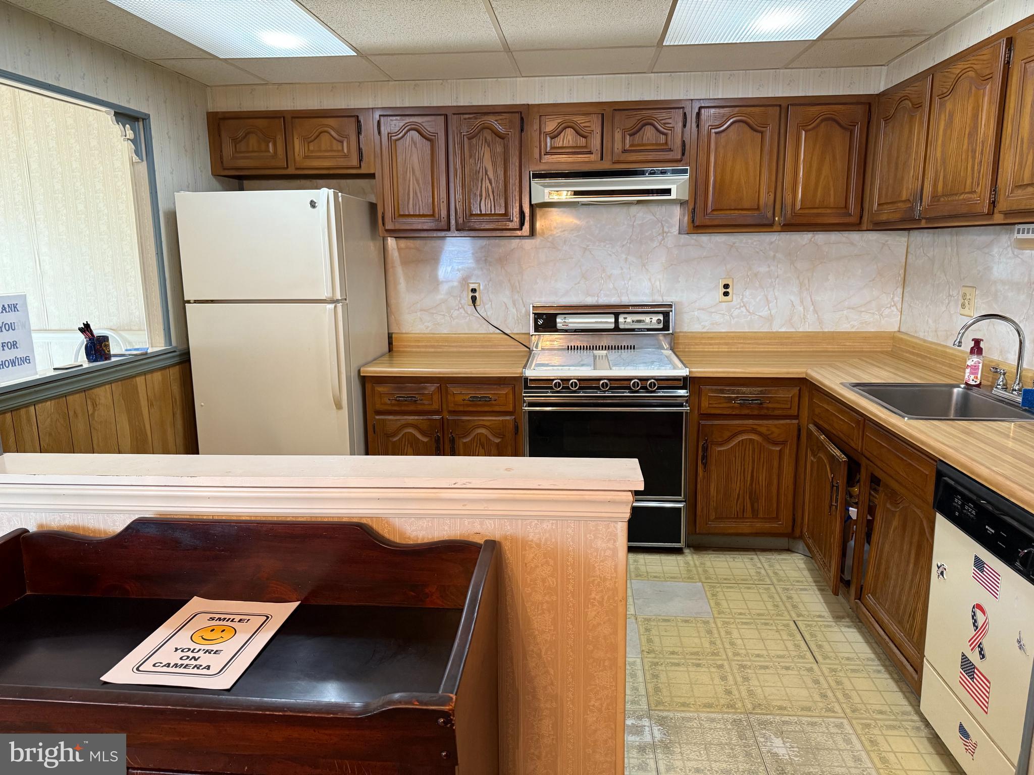 12018 Academy Road Philadelphia, PA 19154 - Photo 5 of 24 a kitchen with stainless steel appliances granite countertop a stove a refrigerator and a sink