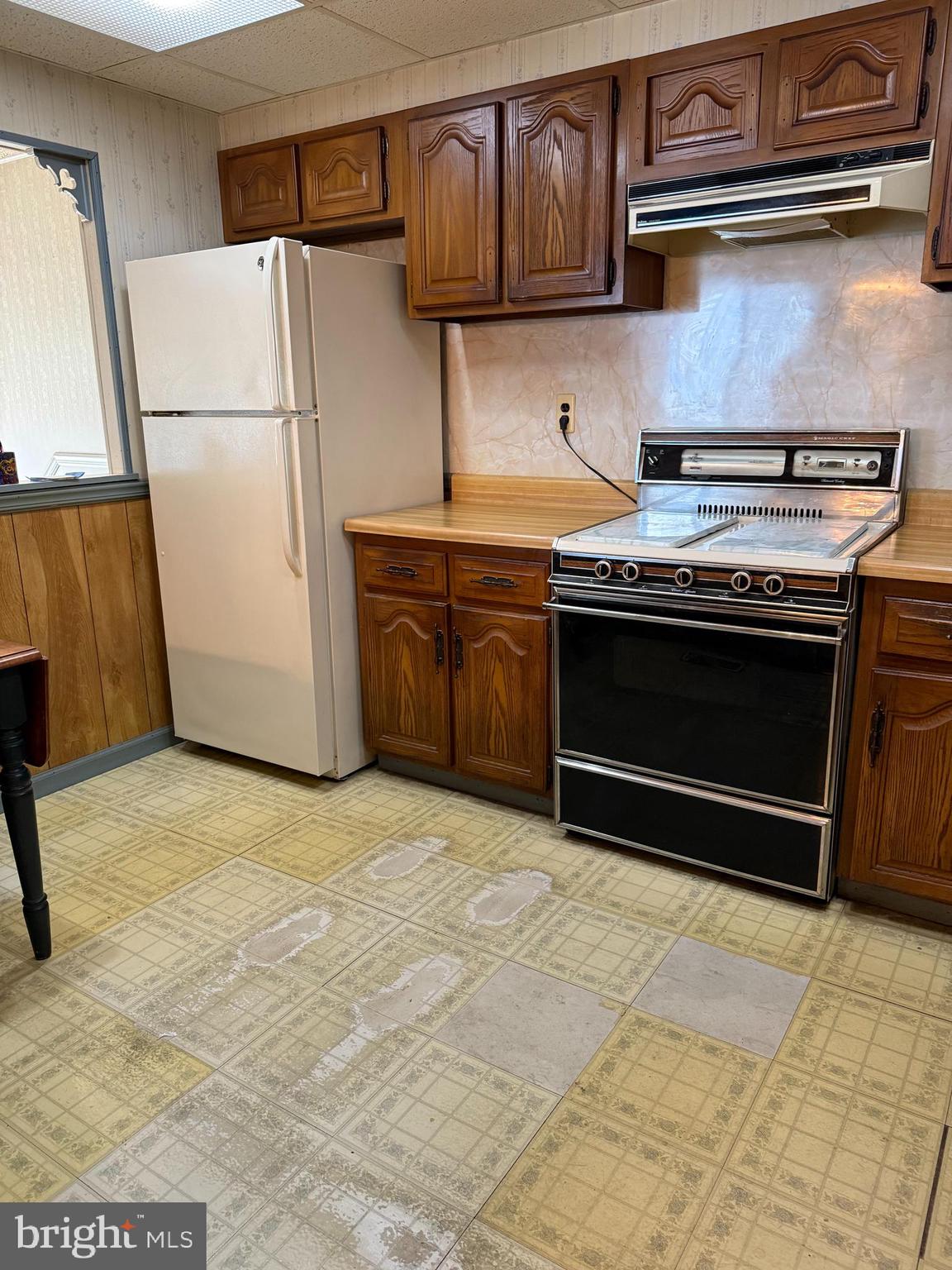 12018 Academy Road Philadelphia, PA 19154 - Photo 6 of 24 a kitchen with stainless steel appliances granite countertop a stove a refrigerator and a cabinets