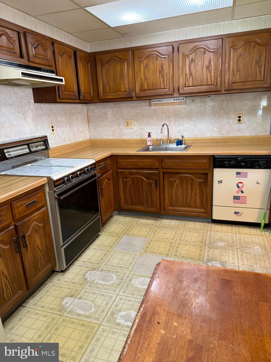 12018 Academy Road Philadelphia, PA 19154 - Photo 7 of 24 a kitchen with stainless steel appliances granite countertop a stove a sink and a granite counter tops