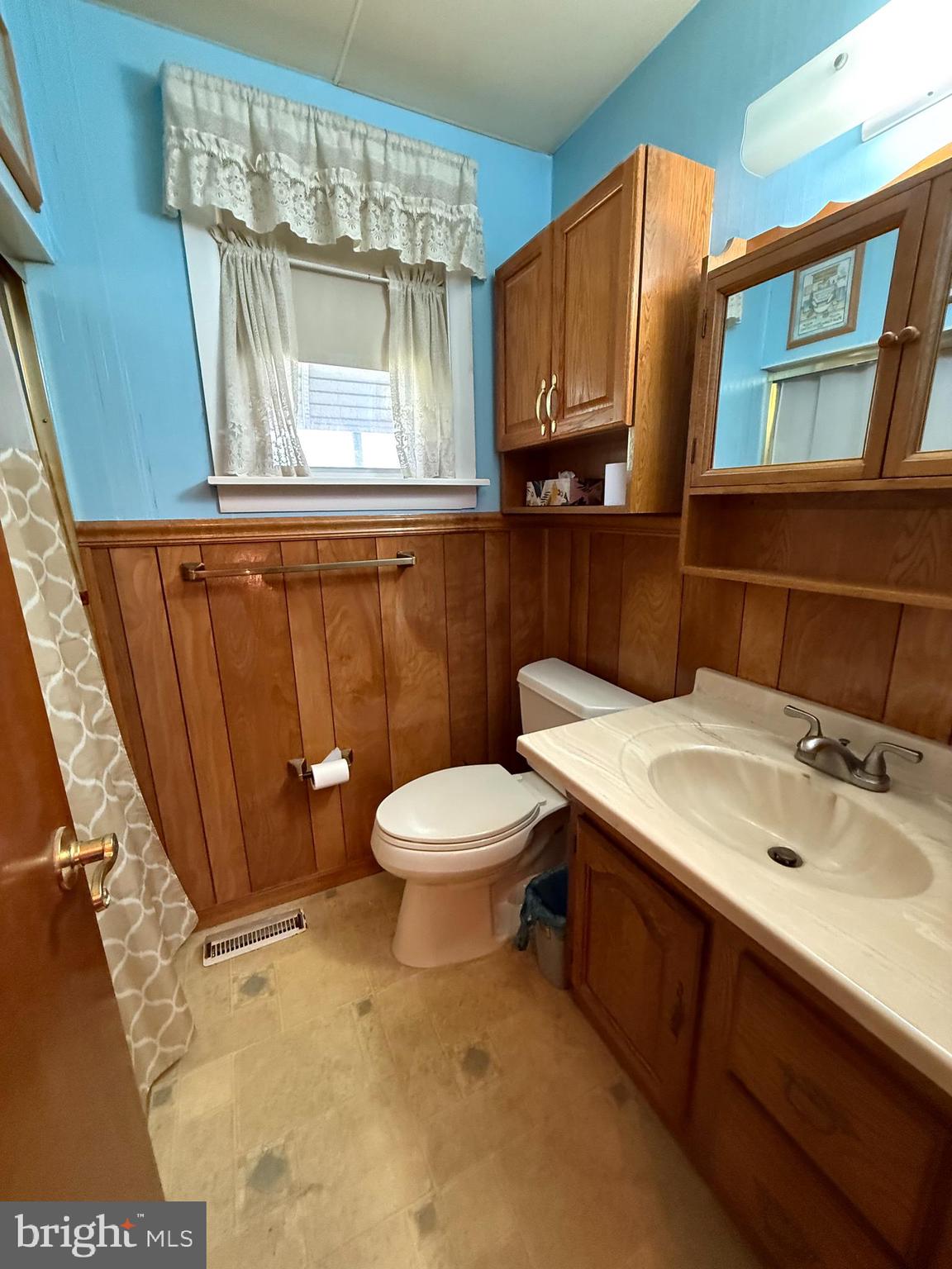 12018 Academy Road Philadelphia, PA 19154 - Photo 8 of 24 a bathroom with a sink a toilet and mirror