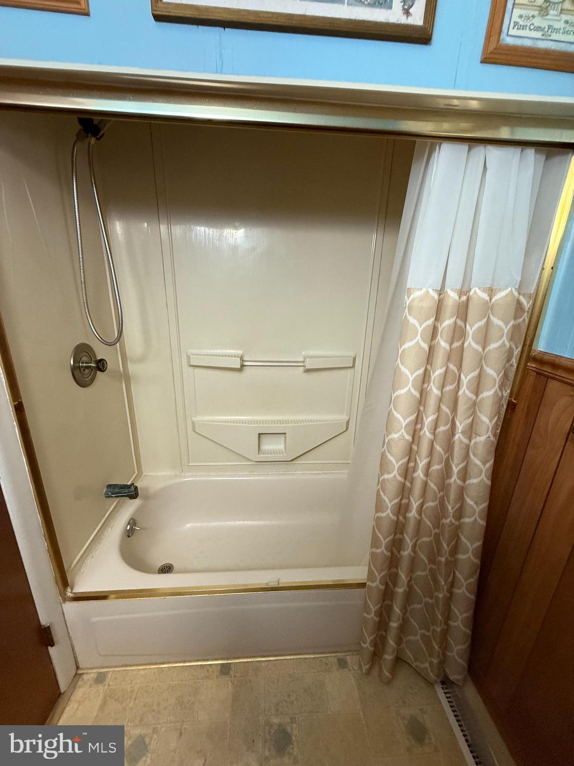 12018 Academy Road Philadelphia, PA 19154 - Photo 9 of 24 a bathroom with a bathtub and shower
