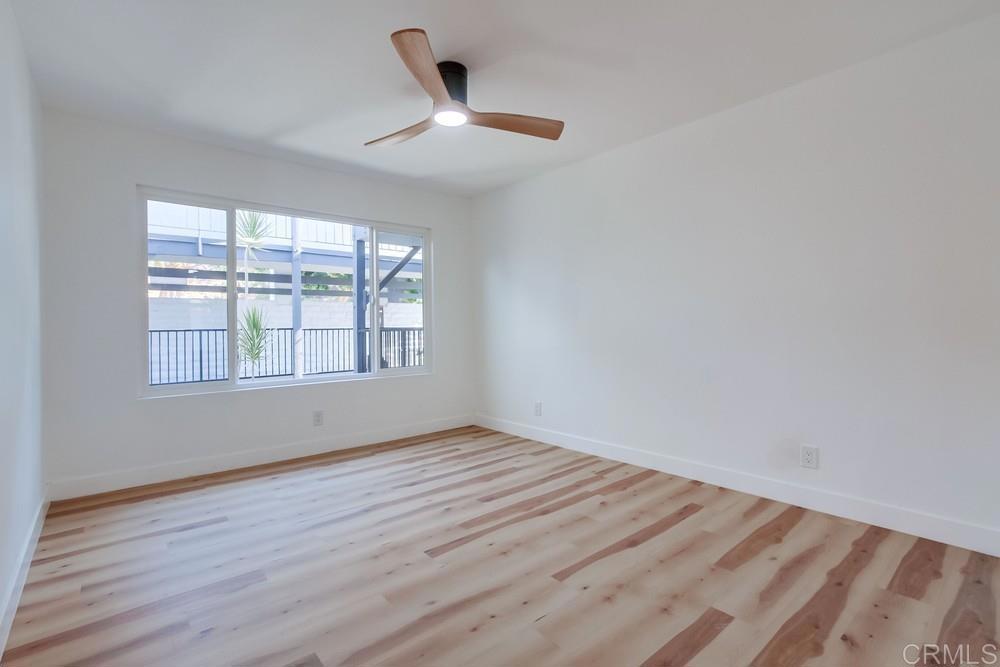 3606 Vista Rey, Unit 37 Oceanside, CA 92057 - Photo 30 of 45 wooden floor in an empty room with a window