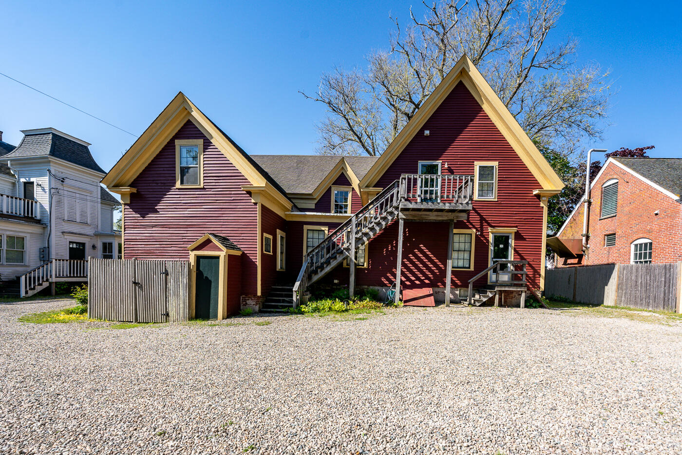 354 Main Street Wellfleet, MA 02667 - Photo 15 of 40 a view of a house with large windows and a yard