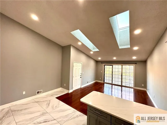 a large white room with a large window