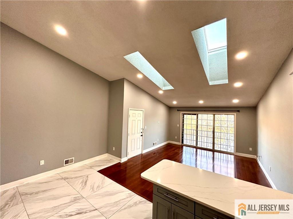 341 Wimbeldon Court North Brunswick, NJ 08902 - Photo 11 of 14 a large white room with a large window