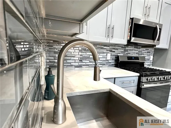 a kitchen with a stove and a microwave