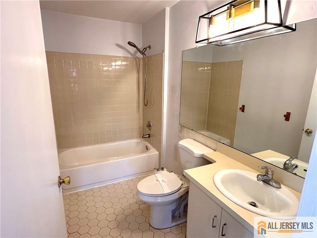 341 Wimbeldon Court North Brunswick, NJ 08902 - Photo 6 of 14 a bathroom with a sink toilet and shower