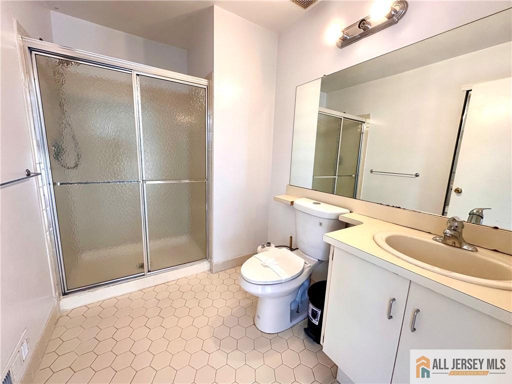 341 Wimbeldon Court North Brunswick, NJ 08902 - Photo 9 of 14 a bathroom with a sink toilet and shower