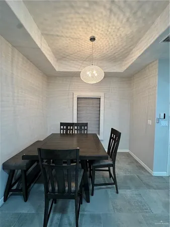 a view of a table and chairs in a room
