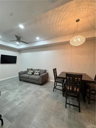 a view of a room with furniture and chandelier