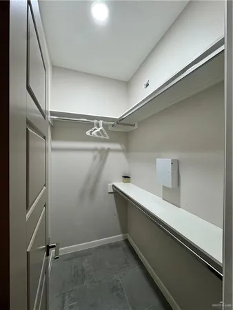 a bathroom with a sink a toilet a mirror and shower