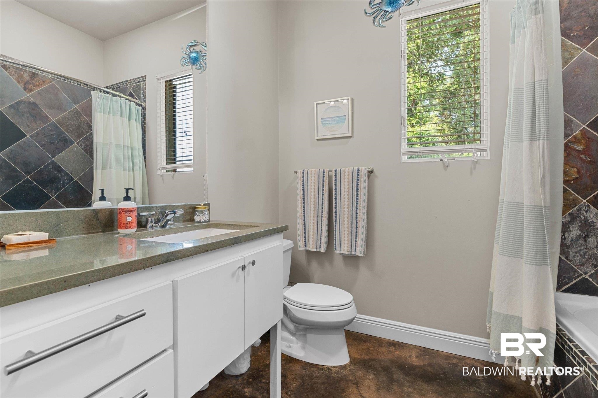 3400 Rue Royal Mobile, AL 36693 - Photo 19 of 33 Bathroom with healthy amount of natural light, vanity, and concrete flooring