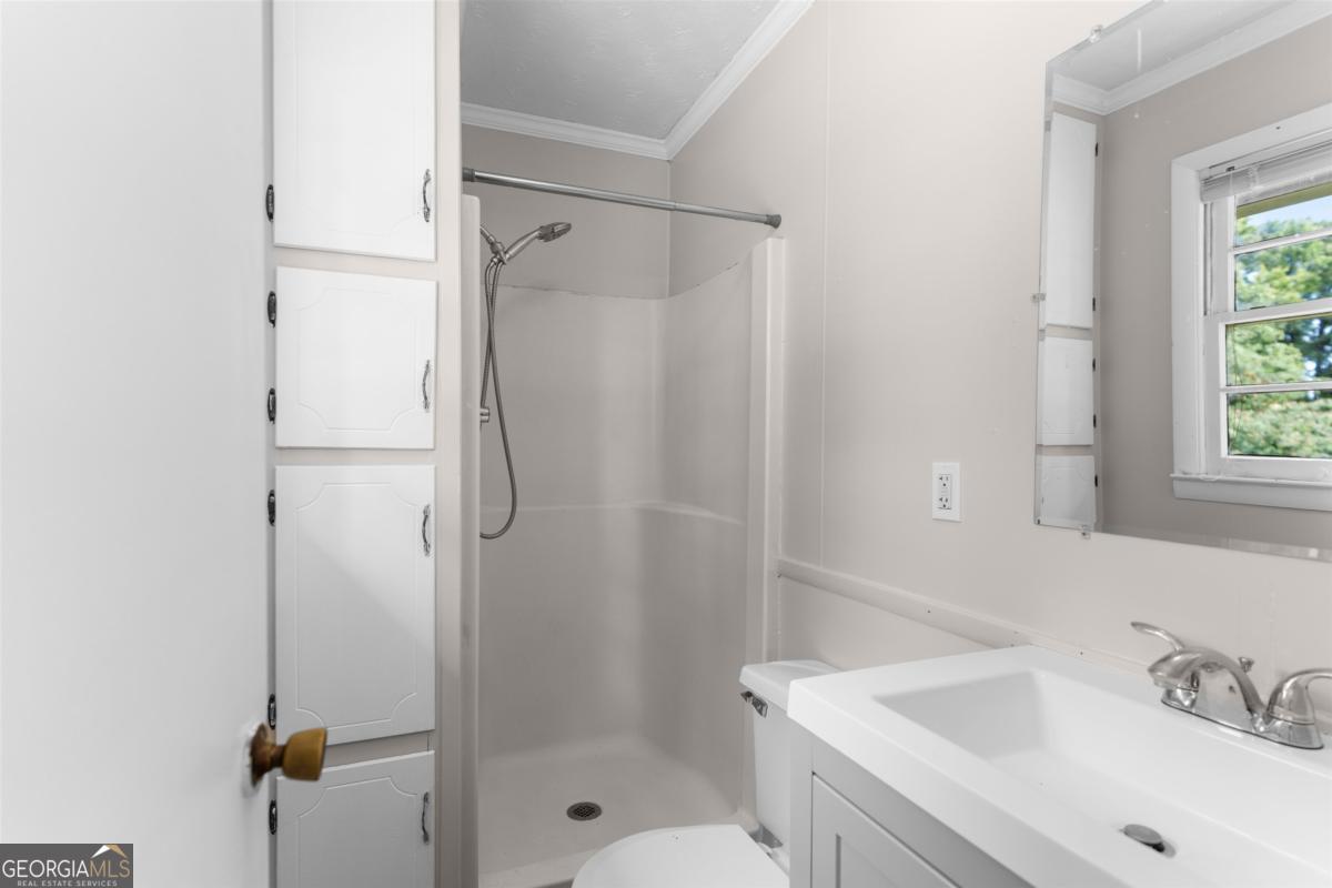 1251 Brickhouse Road Greensboro, GA 30642 - Photo 16 of 35 a bathroom with a shower and a sink