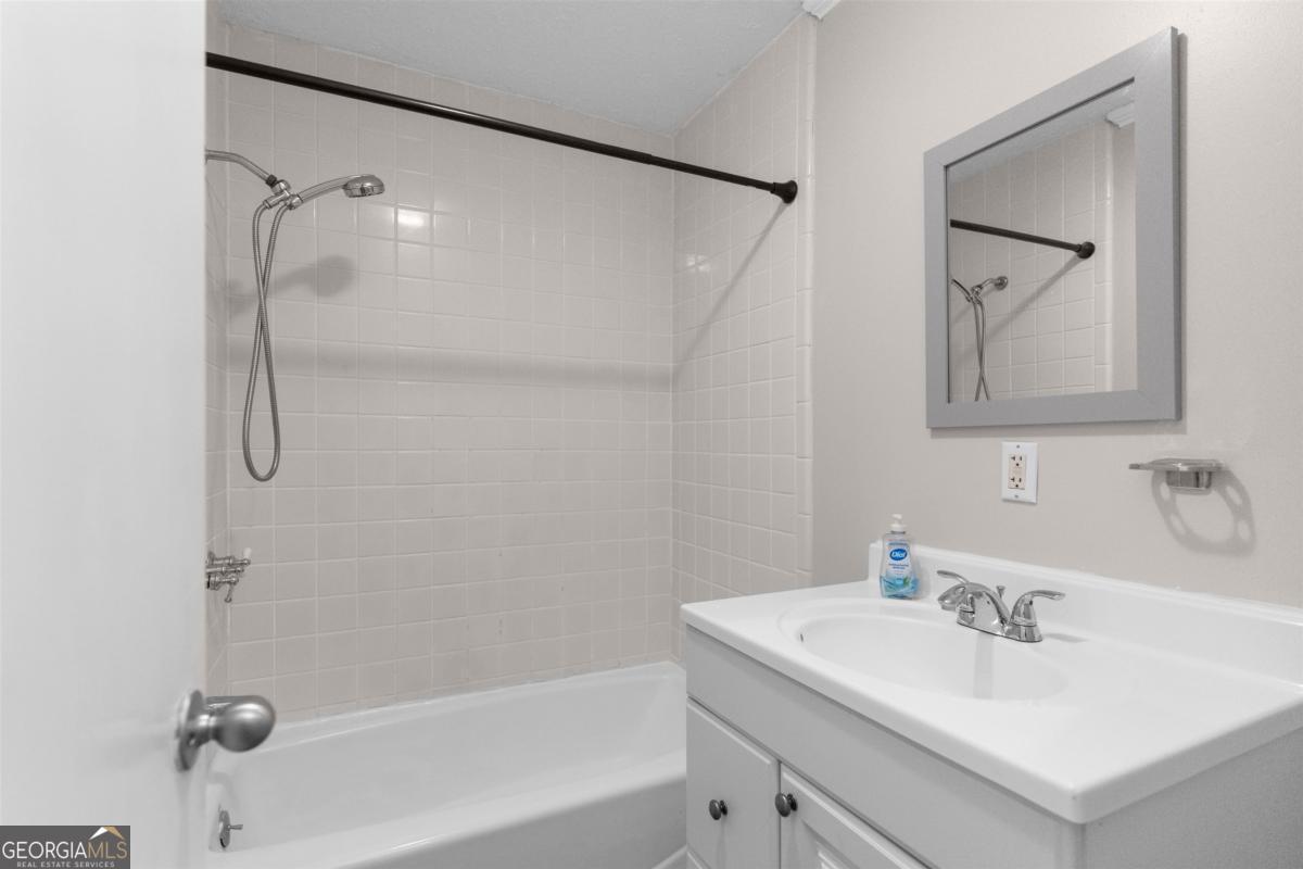 1251 Brickhouse Road Greensboro, GA 30642 - Photo 19 of 35 a bathroom with a sink and a mirror