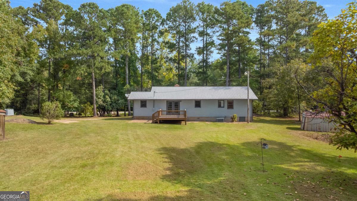 1251 Brickhouse Road Greensboro, GA 30642 - Photo 25 of 35 a view of a house with pool and sitting area